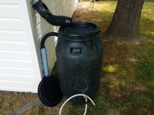 A picture of a rain barrel that can divert overflow back into spouting, for a post on making a rain barrel from LCA. 